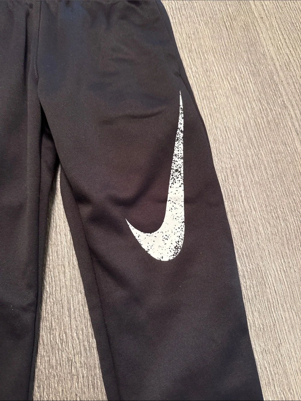 Nike Black Kids Sweatpants with White Swoosh Graphic